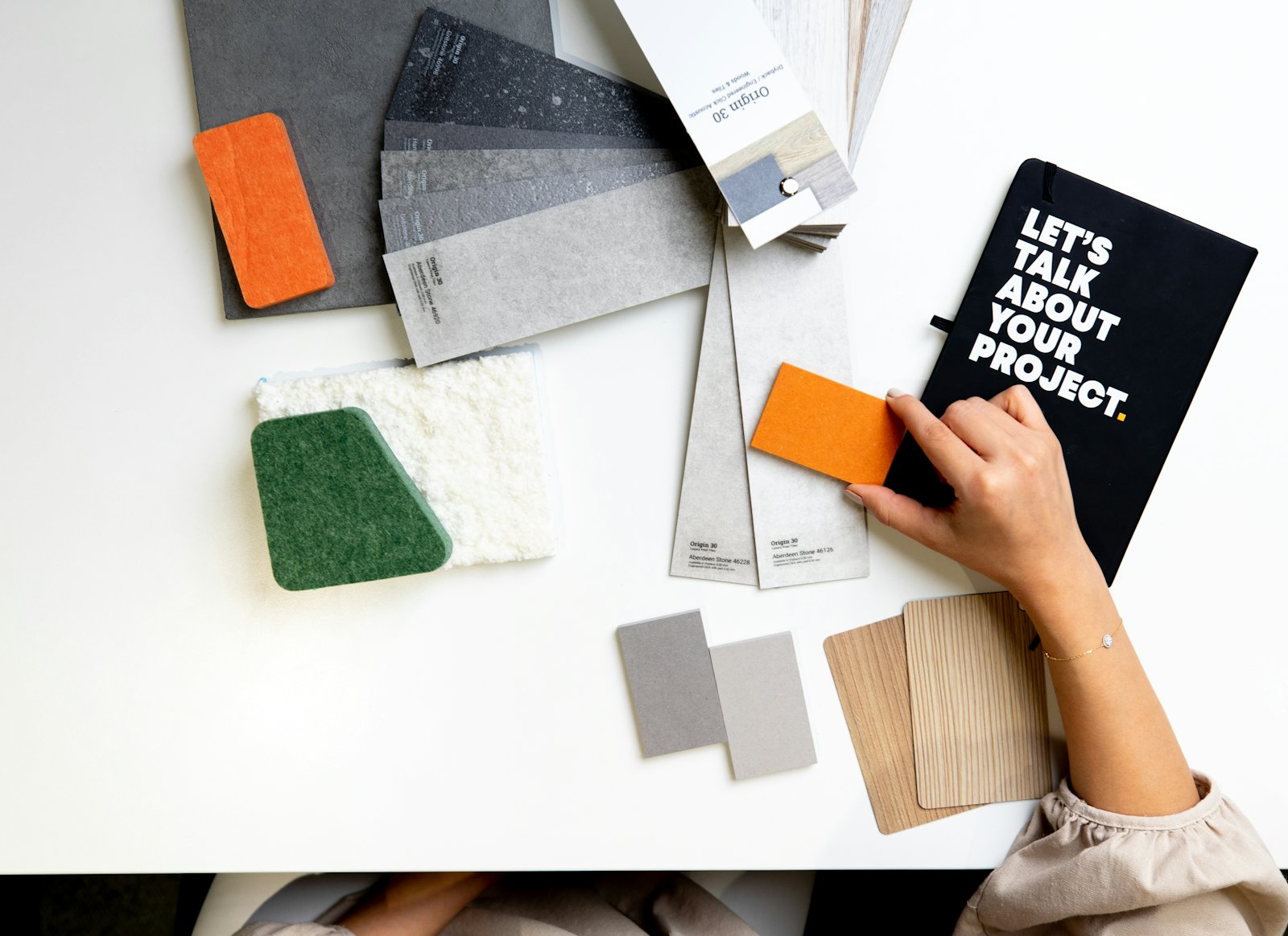 Colour swatches and material samples on the studio table