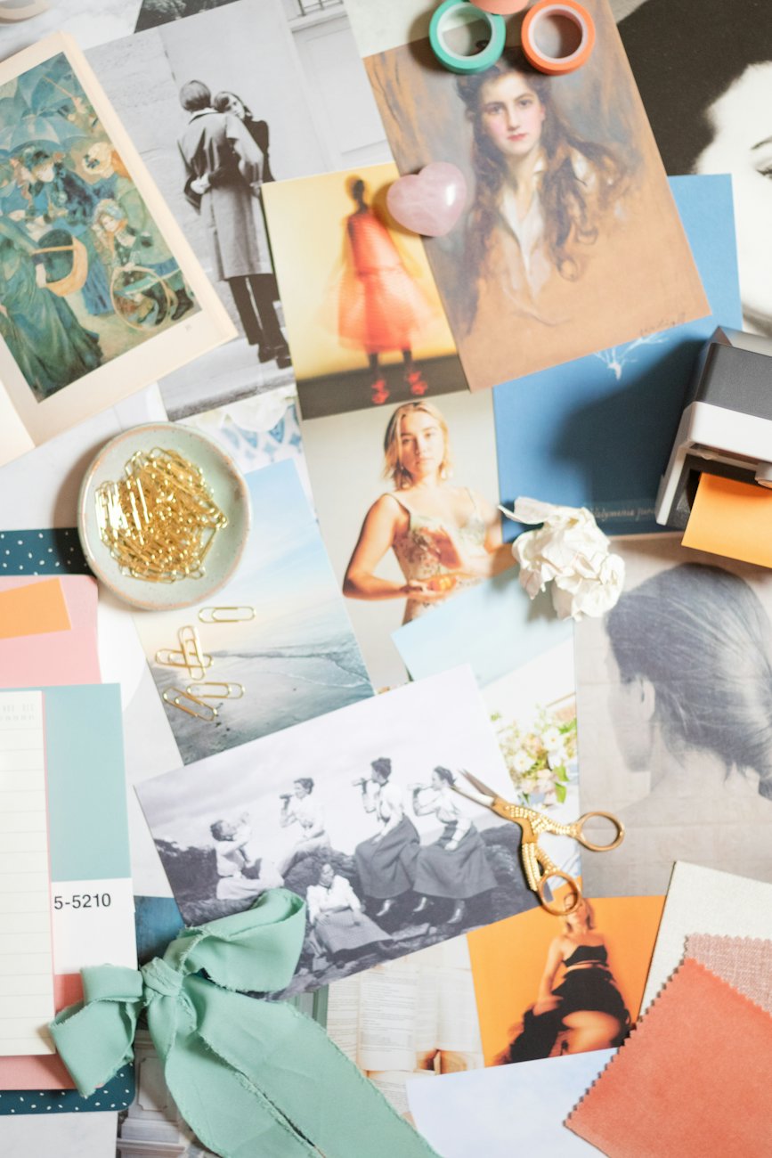 Printed photographs and references on a table