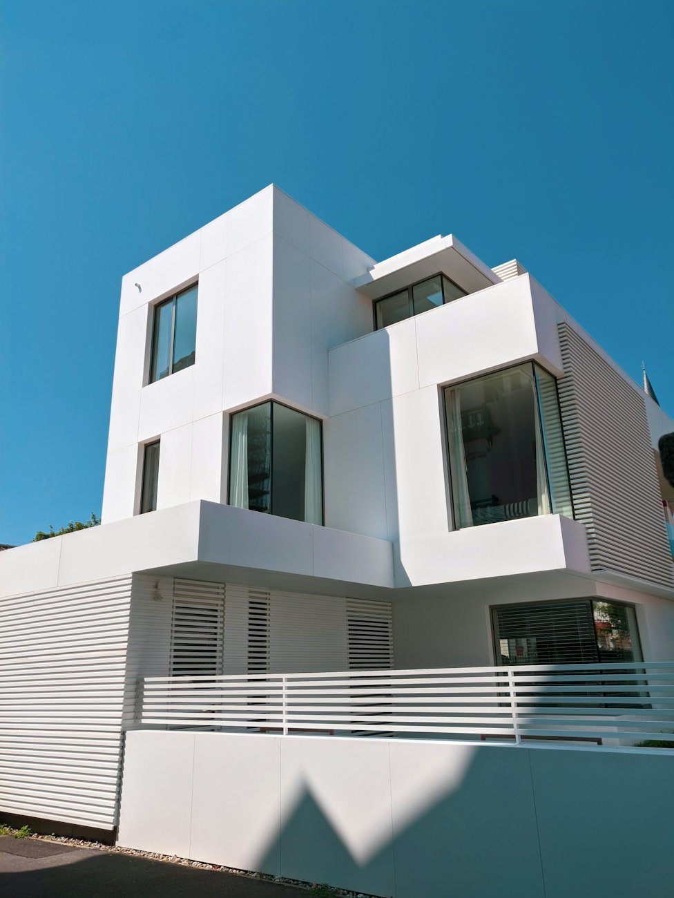 White cubic facade under a blue sky