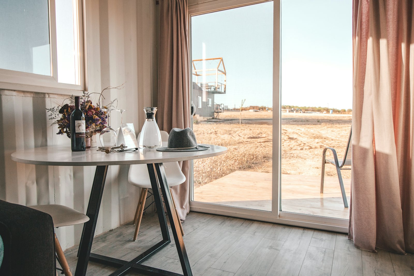 A side table by a tall window