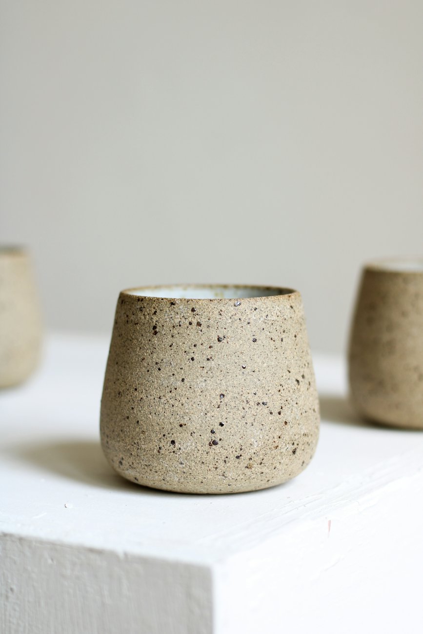 A speckled stoneware cup