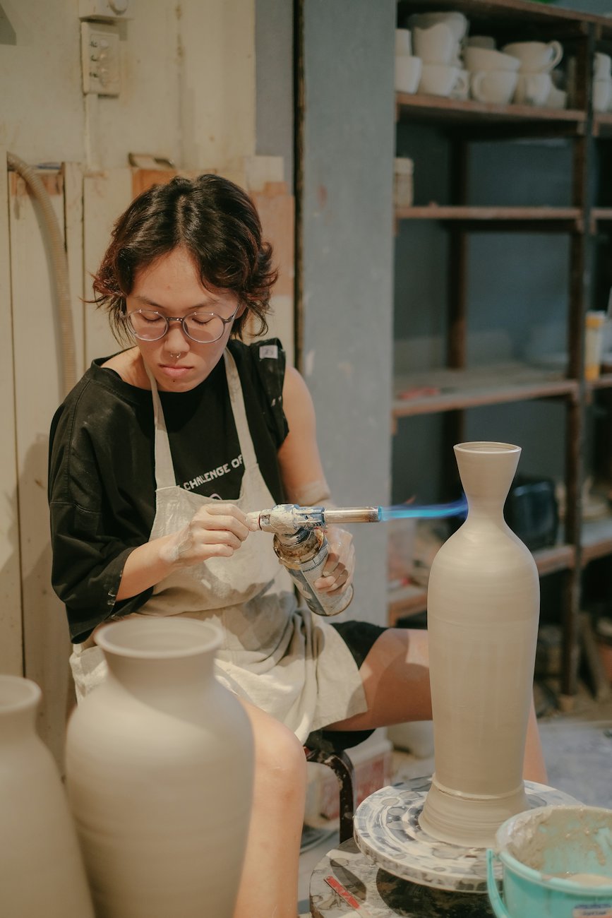A ceramicist shaping a vase